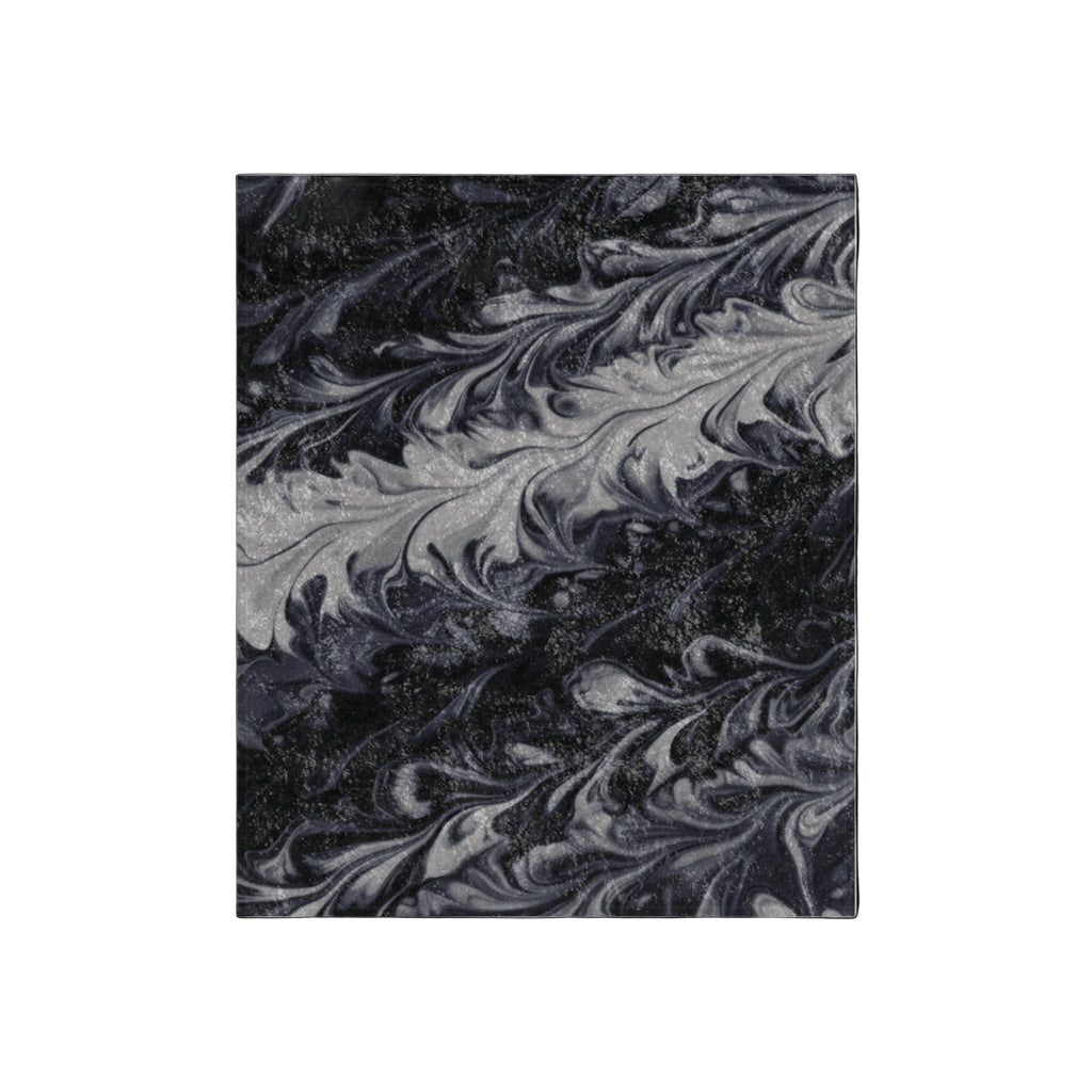 Marbled black and gray pattern blanket on a white background